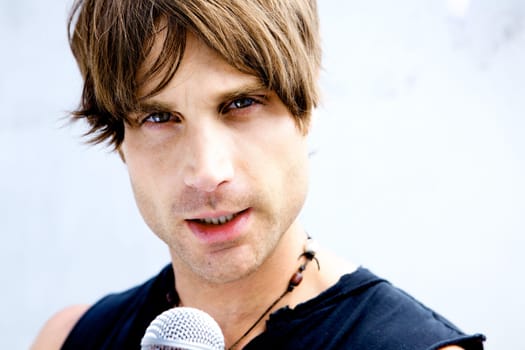 A Rock Star Jamming out with a microphone
