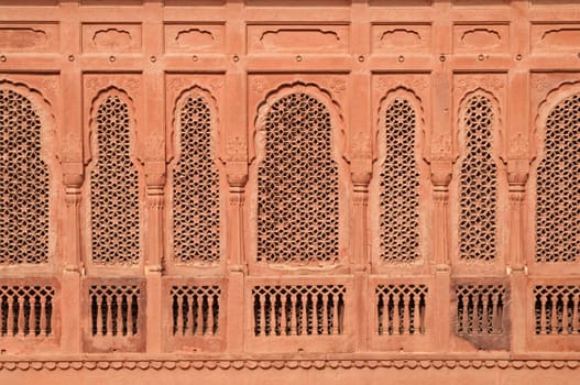 Elaborately carved red sandstone windows of Junagarh Fort, Bikaner, Rajasthan, India