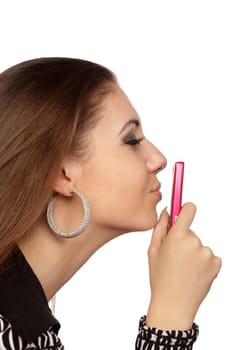 Attractive woman kissing her mobile phone over white