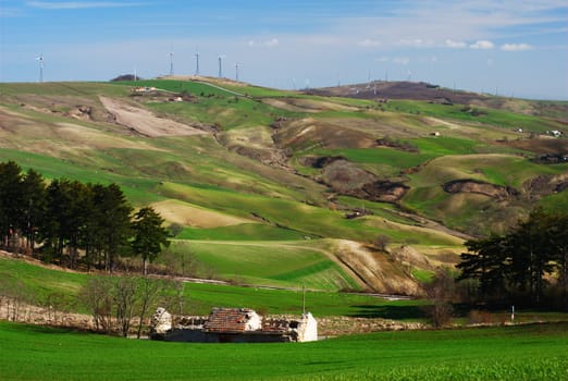 Green hills with a line of wind turbines