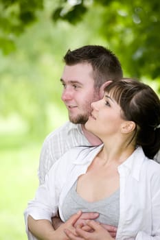 happy young couple relaxing in park