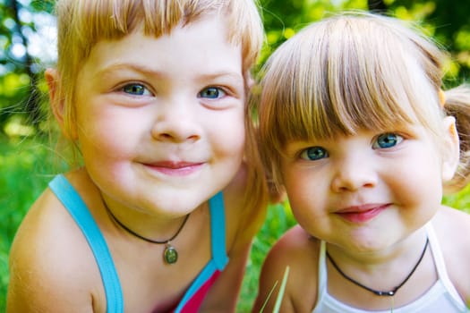 Portrait of two cute smiling sisters or friends
