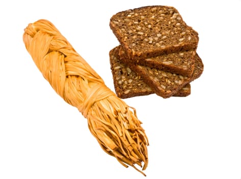 The braided cheese and bread with sunflower seeds of a rough grinding