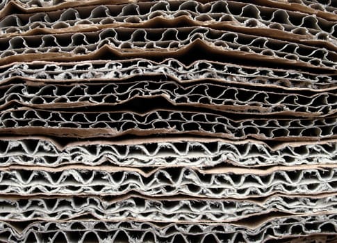 Brown corrugated cardboard sheet useful as a background