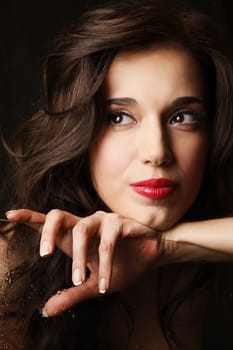Portrait of the beautiful brunette in studio