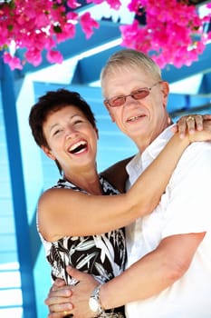 beautiful mature couple smiling looking at the camera
