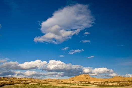 Hill under the cloudy sky in spring season