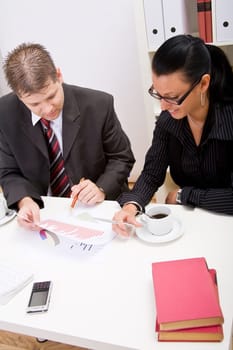 Business man and business woman working in office