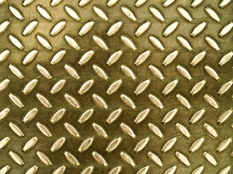 Diamond gold toned metal background texture illuminated by sunlight