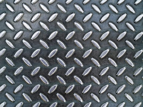 Diamond metal background texture illuminated by sunlight