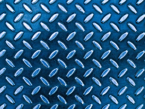Diamond blue toned metal background texture illuminated by sunlight
