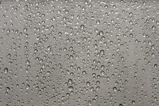 Many small raindrops on a transparent surface