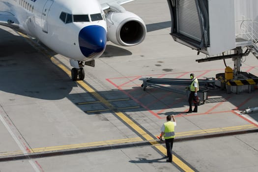 Airplane coming to it's parking stand at the airport