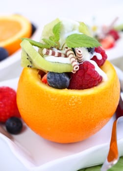 Low calorie dessert - orange filled with fruits