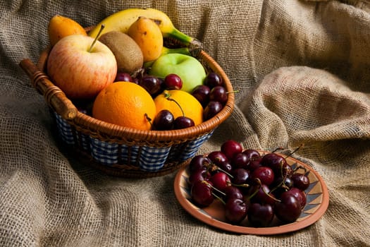 An assortment of fresh mixed fruits in a basket