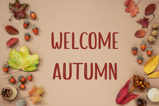 Autumn Background with Autumn Decoration, With Acorns and Fall Leaves and Text Welcome Autumn