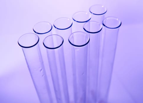 Test tubes on color background