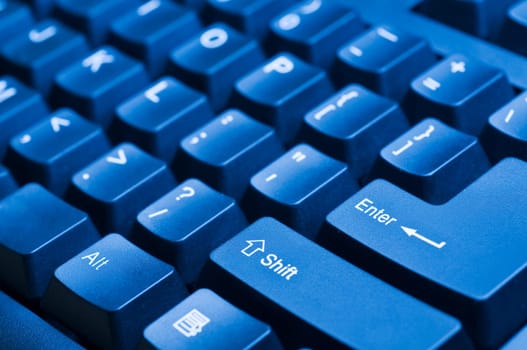 Macro view on the blue computer keyboard