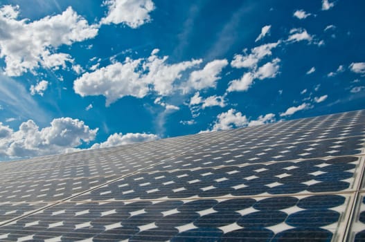 solar panel with beautiful blue sky and clouds in background