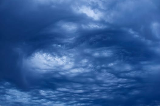 swirling blue storm clouds in sky