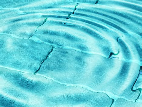 Swimming pool tiles underwater useful as a background