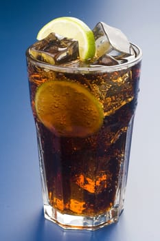 refreshing glass of cola with lemon and ice isolated