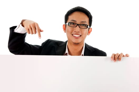 Executive male pointing on a blank space.