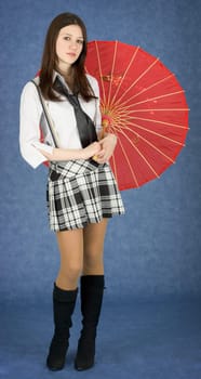Portrait of the young woman with the Japanese umbrella in a hands