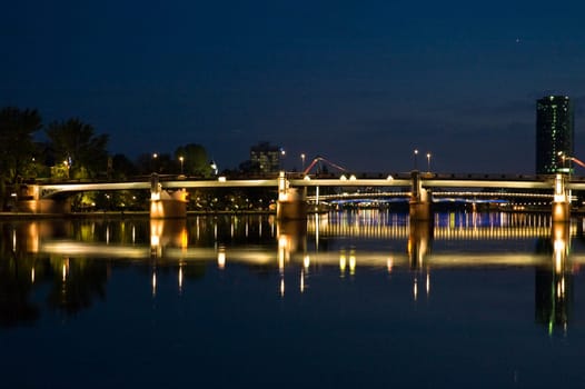 nightshot of frankfurt city including bridges and scyscrapers
