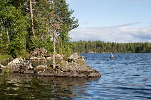 Landscape of Karelian lake and sky with clouds