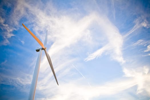 Wind generator with big, blue sky as the back drop.