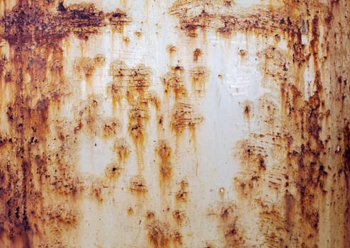 The rough red rusty old peeled metal wall surface