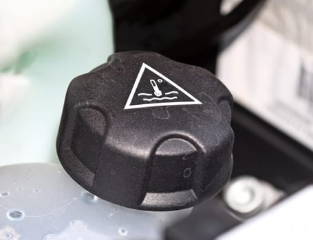 detail of modern car's engine, water place background