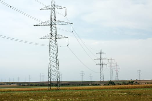 high voltage electric line going through a field