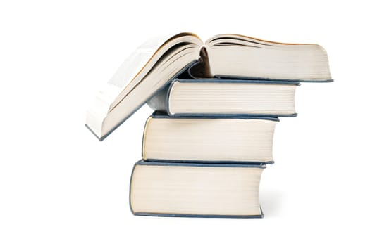 A pile of thick books isolated on a white