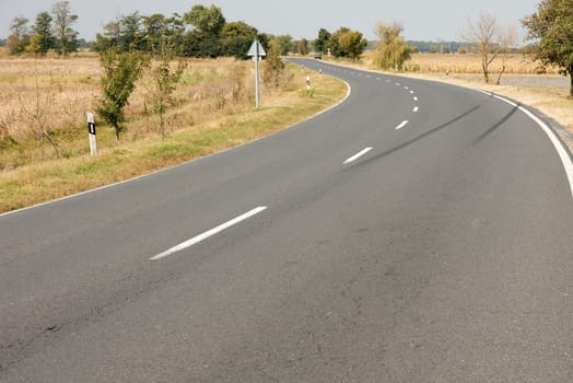 Empty road turning in a rural area