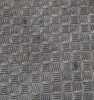 Diamond steel plate useful as a background