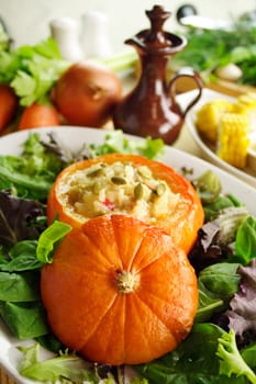 Baked golden nugget pumpkin with rice stuffing ready to serve.