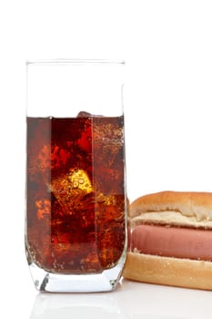 A hot dog and soda glass isolated on white background. Shallow depth of field