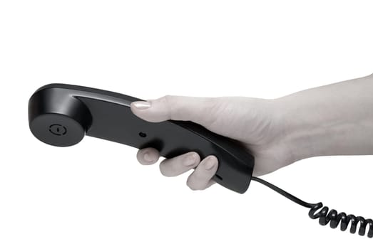 Communication on white. office black telephone with hand dialing.