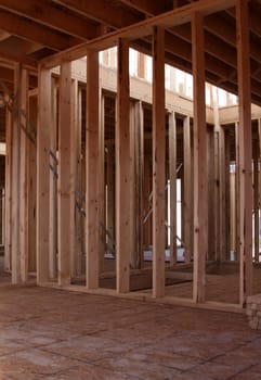 The wood framing of the interior of a new housing project.