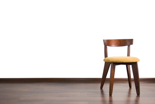 Chair is located in the empty room on the white background.