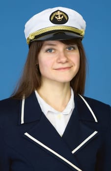 Portrait of the girl - captain on a blue background