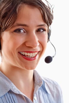 business - young brunette woman with headset on her head