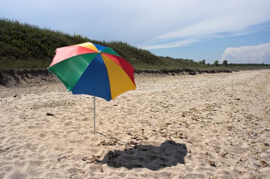 Beach umbrella against summer sky
