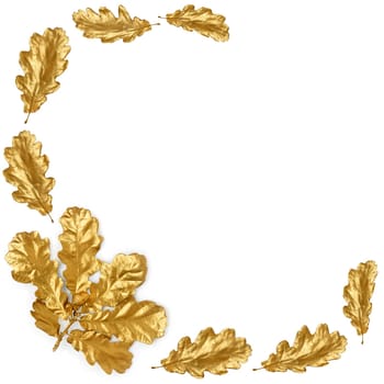 Golden oak leaf spray and acorn with individual leaves forming an abstract border, over white background.