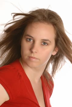 beautiful attractive young woman with hair blowing isolated on white background
