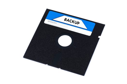 A very old floppy disk on white background