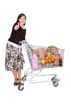 happy young woman with shopping cart