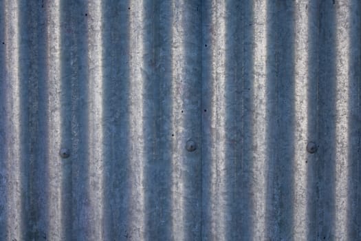 Galvanized and corrugated sheet steel structure with rivets